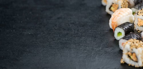 Portion of fresh made Sushi (detailed close-up shot, selective focus)