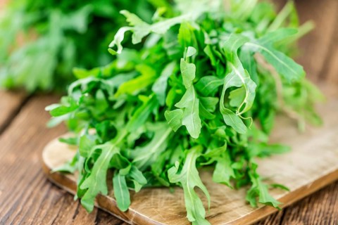 Portion of fresh Arugula (detailed close-up shot, selective focus)