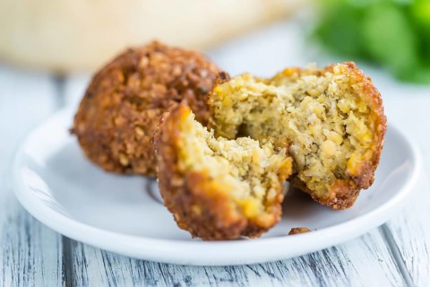 Falafel (close-up shot, selective focus) on an old wooden table