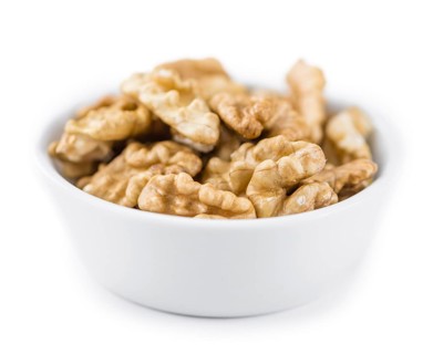 Walnuts (kernels) isolated on white background (selective focus, close-up shot)