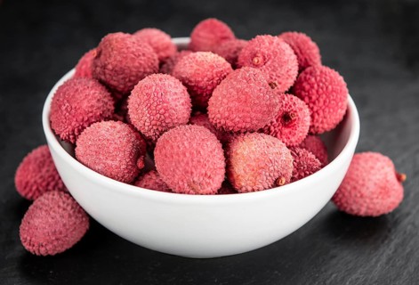 Litchis on a vintage slate slab (close-up shot, selective focus)