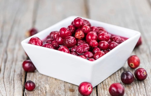 Portion of healthy Cranberries (preserved) (selective focus, close-up shot)