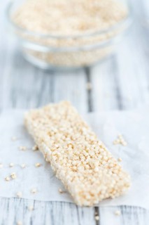 Fresh made Quinoa Bars (selective focus, close-up shot) on an old wooden table
