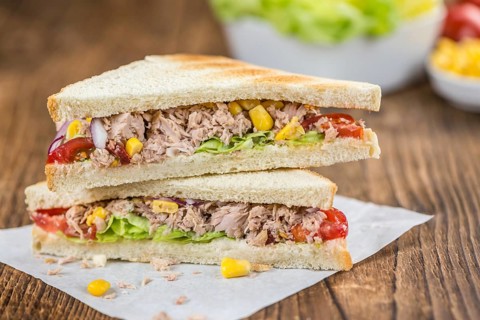 Tuna Sandwich (selective focus, close-up shot) on vintage background