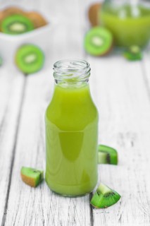 Fresh made Kiwi Smoothie (selective focus) on a vintage looking background