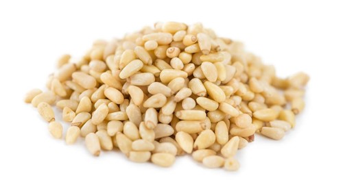 Pine Nuts isolated on white background (selective focus, close-up shot)