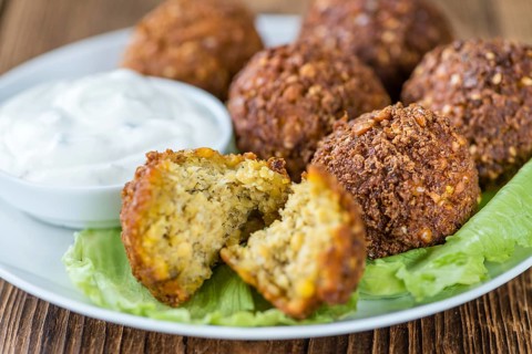 Homemade Falafel (close-up shot, selective focus) on wooden background