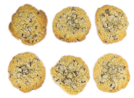 Chocolate Chip Cookies as detailed close-up shot isolated on white background (selective focus)