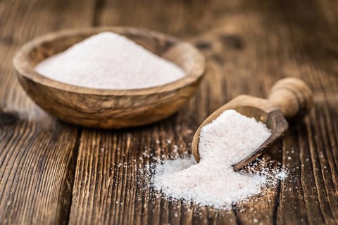 Pink Salt on a vintage background as detailed close-up shot (selective focus)
