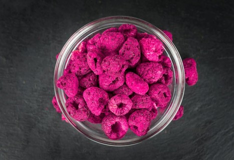 Some homemade Raspberries (dried) as detailed close-up shot, selective focus