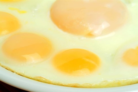 Food, quail eggs, quail egg, Coturnix coturnix, prepared as fried eggs, in the centre a hen's egg