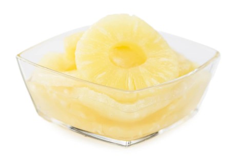 Fresh made Preserved Pineapple Rings isolated on white background, close-up shot