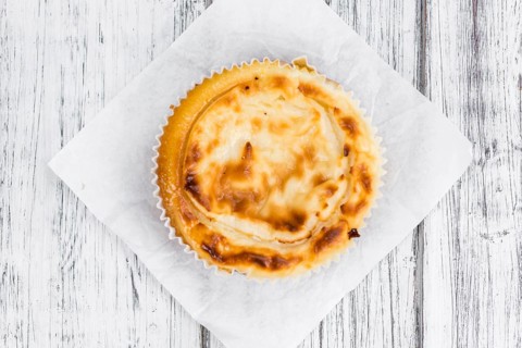 Homemade Cheesecake on an wooden table (selective focus) as detailed close-up shot