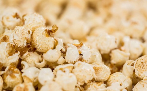 Some homemade Popcorn as detailed close-up shot, selective focus