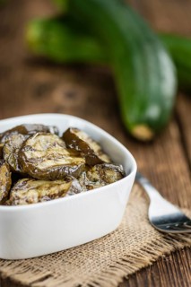 Homemade Antipasti (Grilled Zucchinis) on vintage background (selective focus, close-up shot)