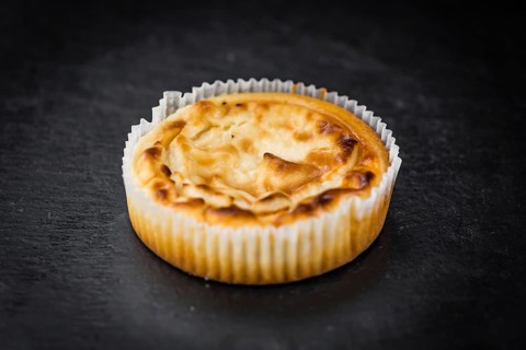 Homemade Cheesecake on vintage background (selective focus, close-up shot)