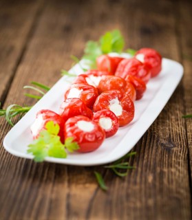 Some homemade Red Pepper (stuffed with cheese) (selective focus) as detailed close-up shot