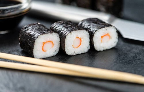 Slate slab with some Sushi (selective focus, close-up shot)