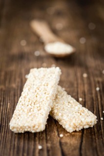 Portion of homemade Quinoa Bars (selective focus, close-up shot)