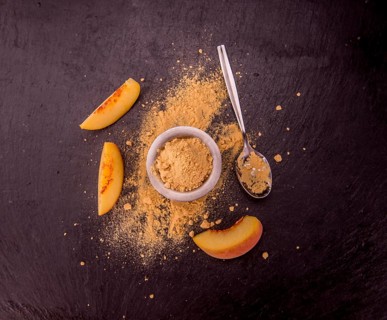 Peach powder on a vintage slate slab as detailed close-up shot, selective focus