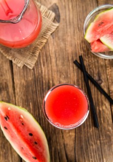 Watermelon Smoothie on rustic wooden background (close-up shot)