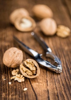 Walnuts on a vintage background as detailed close-up shot (selective focus)