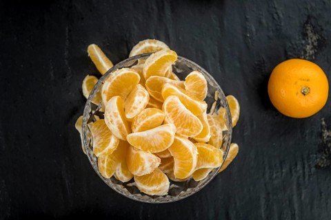 Portion of tangerines (close-up shot) on a vintage background (selective focus)