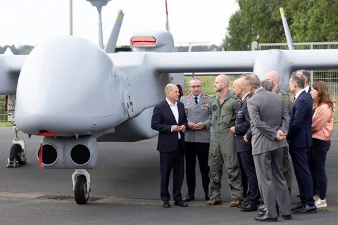 Olaf Scholz (Chancellor of the Federal Republic of Germany, SPD) in front of an IAI Heron TP drone