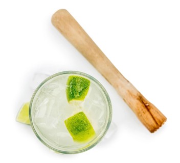 Caipirinha as detailed close-up shot isolated on white background (selective focus)