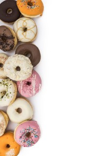 Fresh made Donuts isolated on white background (selective focus)