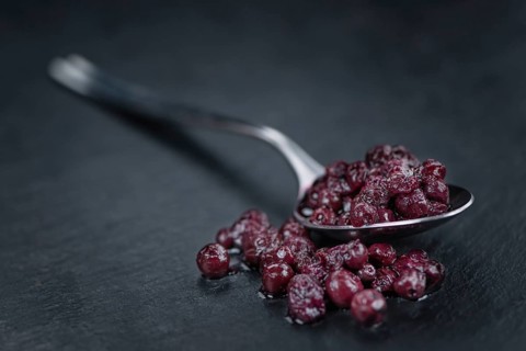 Canned Blueberries on a vintage slate slab as detailed close-up shot, selective focus
