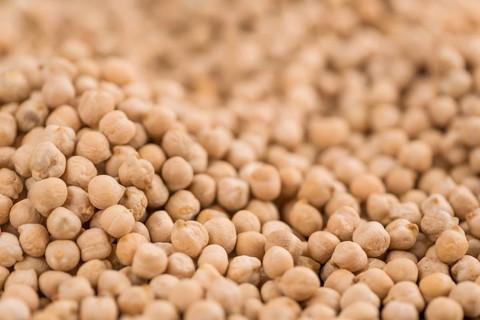 Chickpeas on a vintage background as detailed close-up shot, selective focus