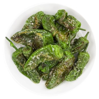 Portion of Pimientos de Padron as detailed close-up shot isolated on white background
