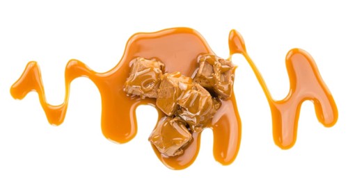 Caramel Sauce on a vintage slate slab (close-up shot, selective focus)