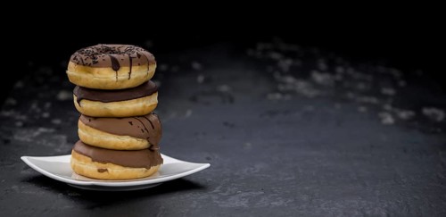 Portion of some Donuts as detailed close-up shot (fresh made, selective focus)