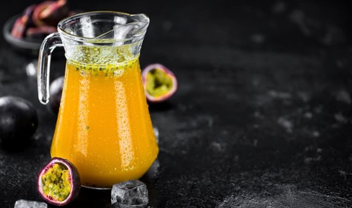 Maracuja Juice on a vintage looking slate slab (selective focus)