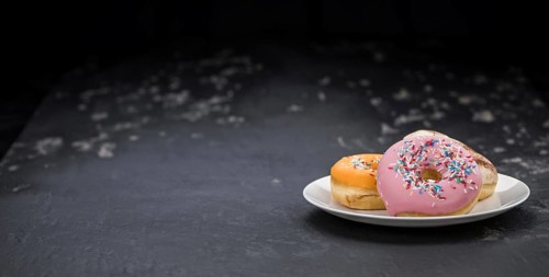 Portion of some Donuts as detailed close-up shot (fresh made, selective focus)