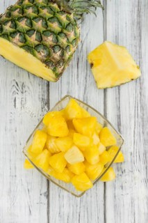 Fresh made Pineapple (sliced) on a vintage background as detailed close-up shot