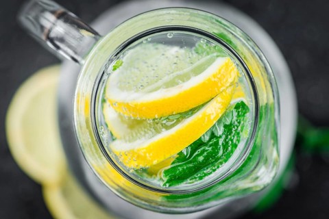 Portion of Lemonade as detailed close up shot on a slate slab (selective focus)