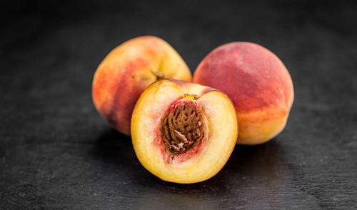 Some Peaches on a vintage slate slab, selective focus