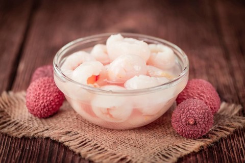 Preserved Lychees on a vintage background as detailed close-up shot (selective focus)