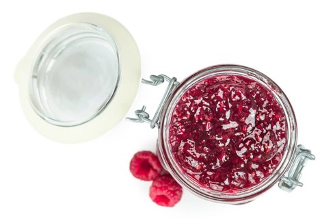 Raspberry Jam isolated on white background, selective focus, close-up shot
