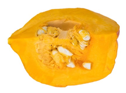 Portion of fesh Pumpkin (close-up shot) isolated on a white background