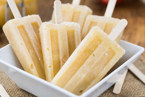 Fresh made Apple Popsicles (selective focus, close-up shot) on a vintage background