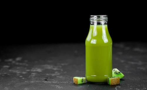 Fresh made Kiwi Smoothie (selective focus) on a vintage looking background