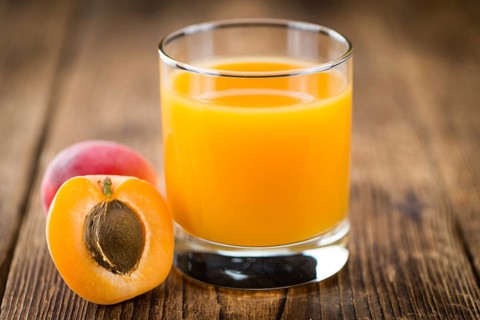 Some homemade Apricot Juice (selective focus) as detailed close-up shot
