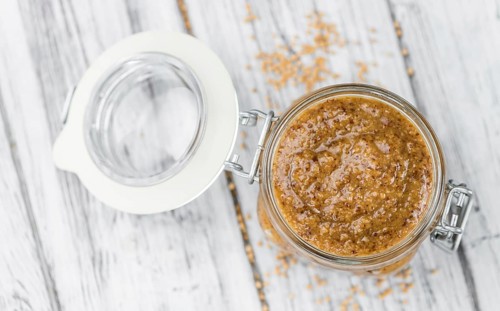 Fresh made German Cuisine (sweet Mustard) on a vintage background (close-up shot)