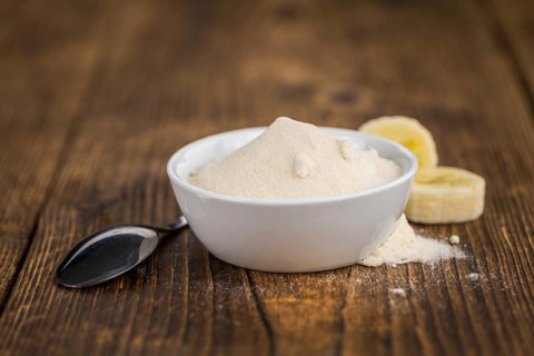Banana Powder on rustic wooden background as close-up shot