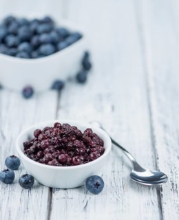 Preserved Blueberries on a vintage background as detailed close-up shot, selective focus