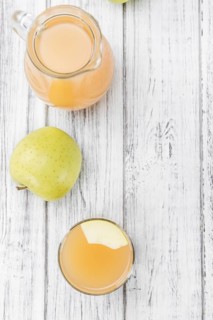 Fresh made Juice (apple) on a vintage background (close-up shot)